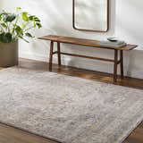 Entryway scene with a neutral Addax Area Rug, wood bench, mirror, and potted plant. Roomscene-Rectangle