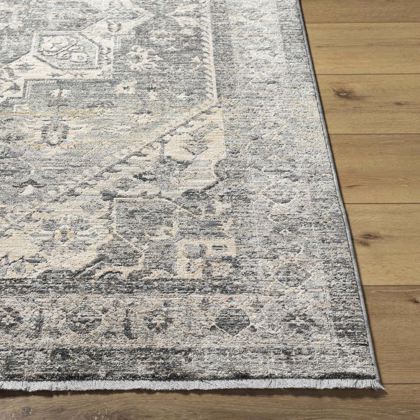 Close-up of the Ailsa Area Rug showing its traditional dark gray, gray, and lambswool pattern and soft texture. Front