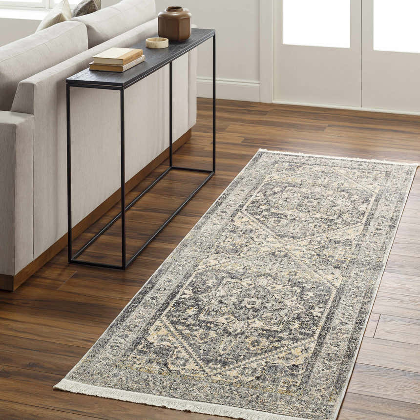 Living room scene with gray sofa, console table, and Ailsa Area Rug in dark gray, lambswool, and brown tones. Roomscene-Runner