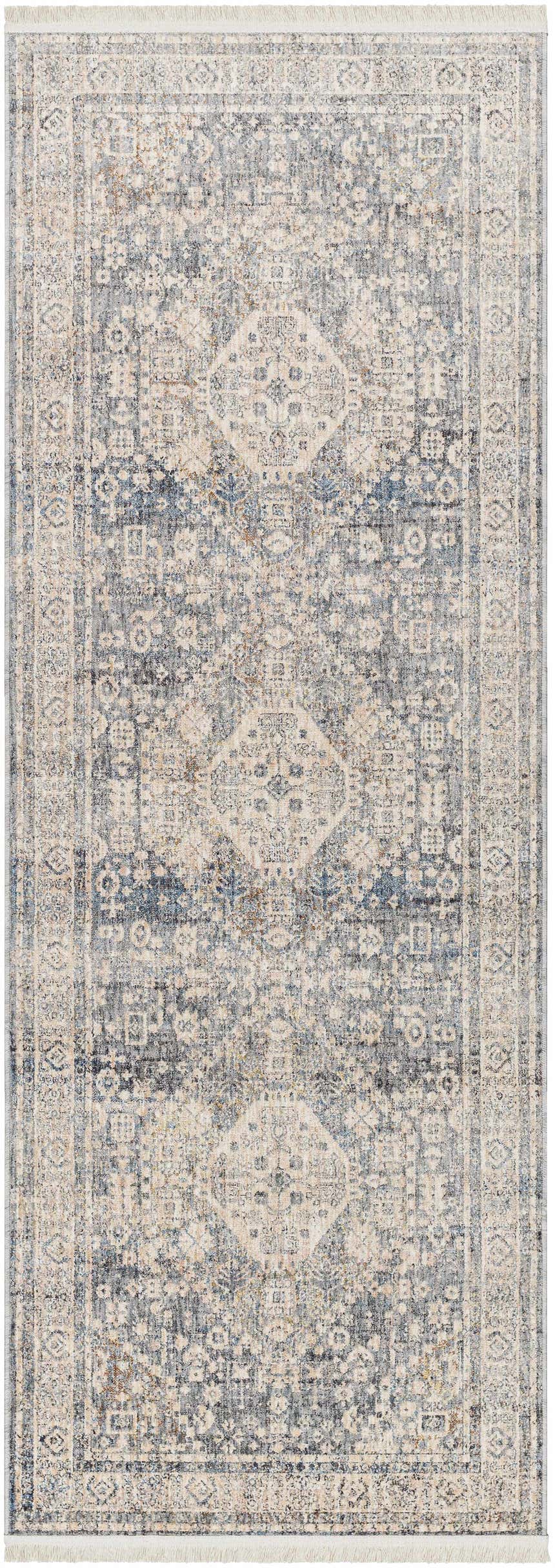 Close-up of the Artan Area Rug; a machine-woven runner with a traditional design in dark brown, gray, and natural tones. Design-Runner-2108