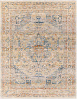 Close-up of the Bora Area Rug. Traditional style rug in camel, copper, and blue tones. Machine woven polyester rug. Design-Rectangle-71010