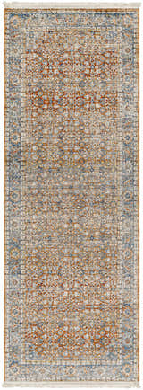 Detailed close-up of the Dalit Area Rug in clay, copper, and denim. Traditional, machine-woven design with fringe. Design-Runner-2108