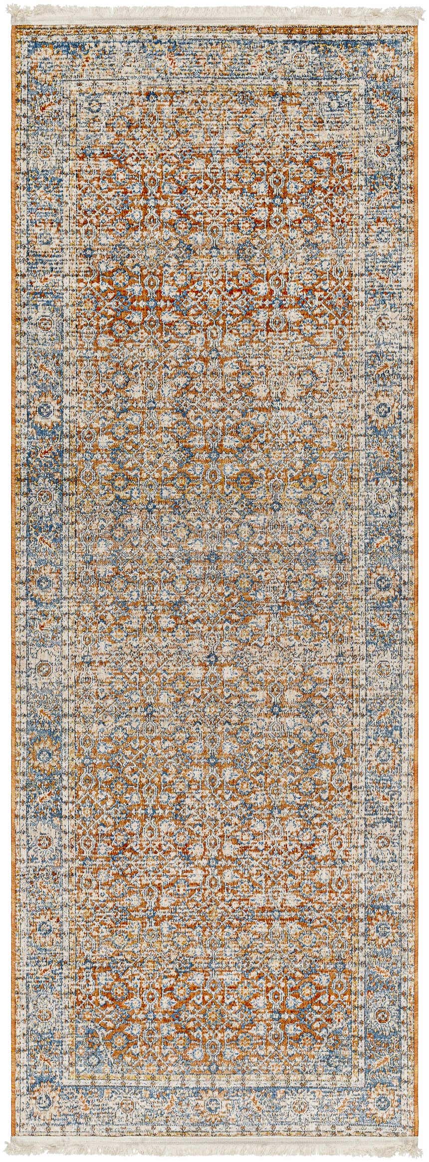 Detailed close-up of the Dalit Area Rug in clay, copper, and denim. Traditional, machine-woven design with fringe. Design-Runner-2108