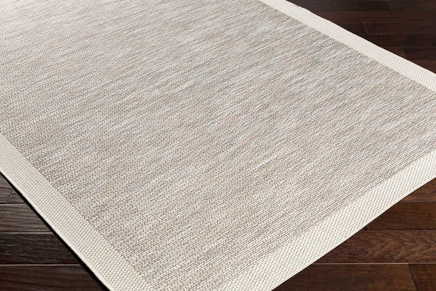 Close-up of the Escalon Area Rug. Cream and taupe striped design, machine woven texture, and a solid cream border. Corner