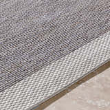 Close-up of the Escalon Area Rug, cream and taupe woven texture, contemporary solid and striped design. Texture