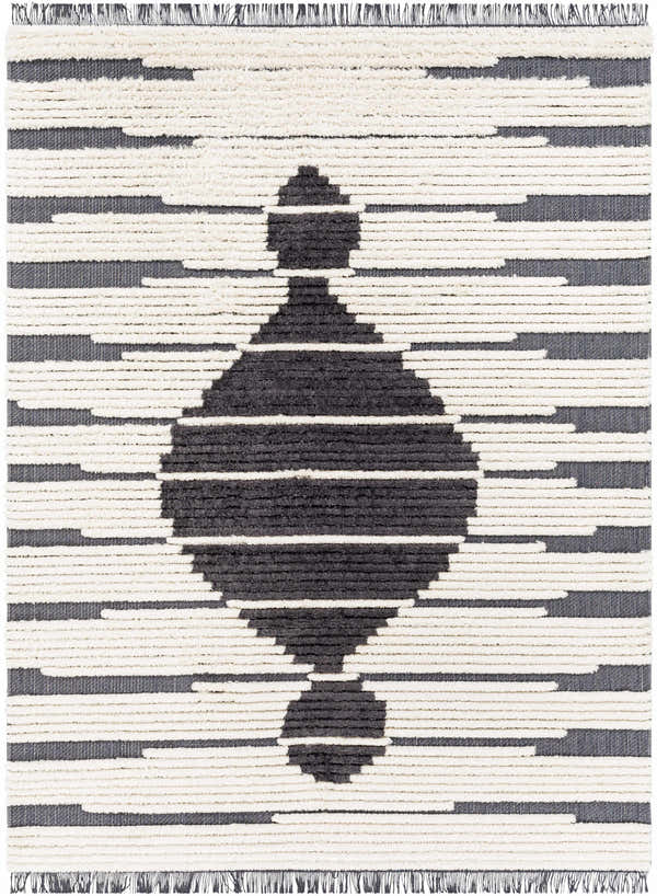 Close-up of the Sedef Area Rug. Black and cream rug with a bohemian geometric design and fringe. Design-Rectangle-537