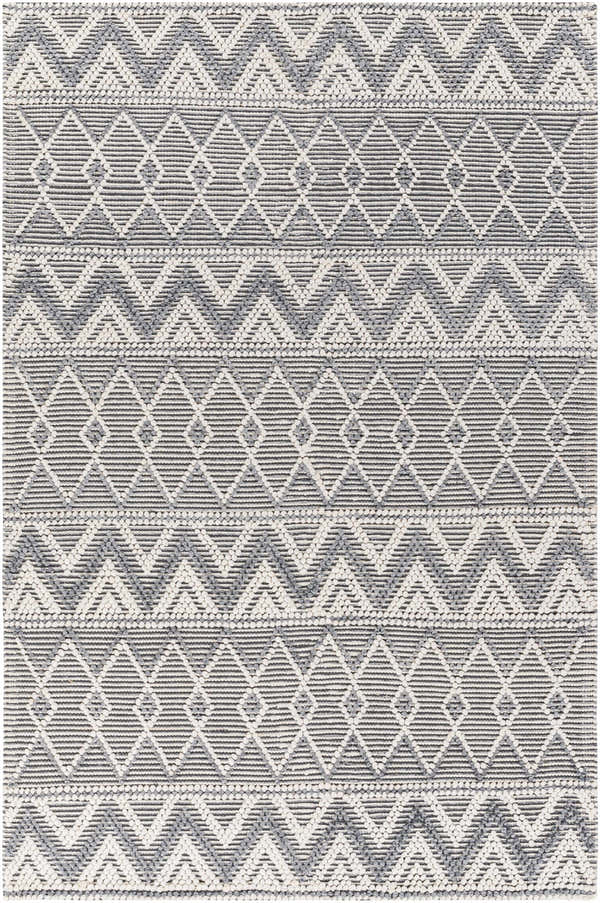 Close-up of the hand woven Evita Area Rug. Dark gray, light gray geometric pattern. Farmhouse, Scandinavian style. Design-Rectangle-576