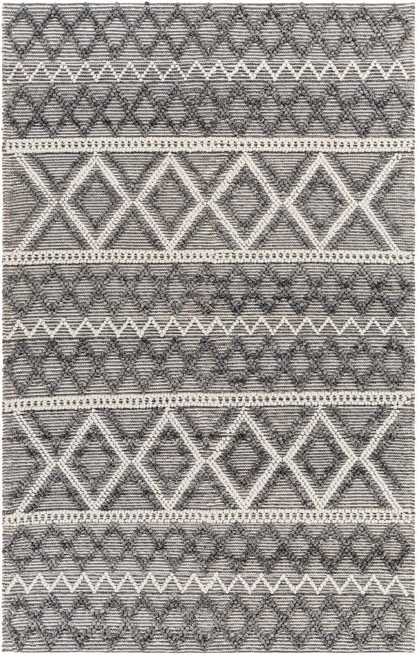 Close-up of the hand woven Yuka Area Rug. Dark gray and natural gray geometric pattern with textured recycled PET yarn. Design-Rectangle-576