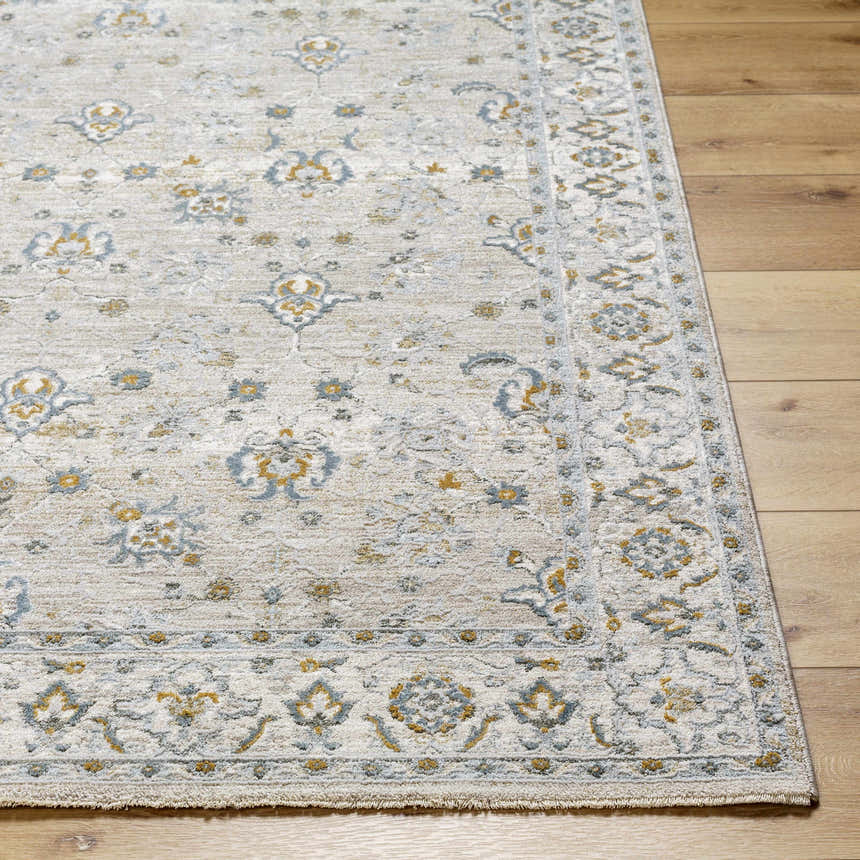 Close-up of Amaru Cream & Sage Textured Rug. Features a traditional floral pattern in sage, cream, and mustard tones. Front