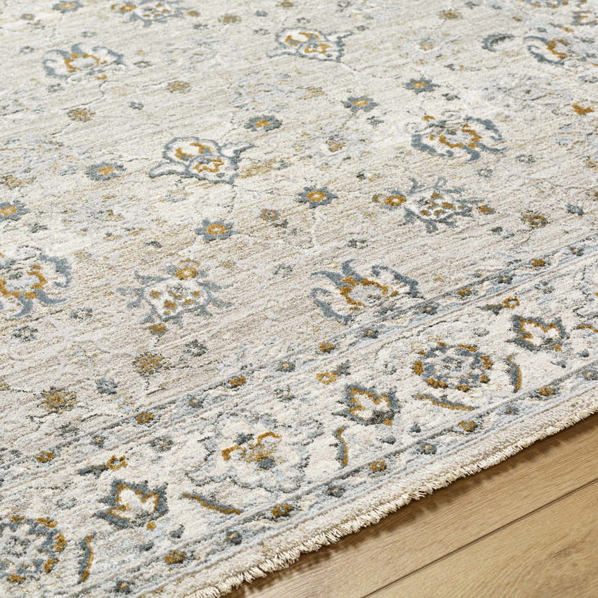 Close-up of the Amaru Cream & Sage Textured Rug with Fringes. Features floral patterns in cream, sage, and mustard tones. Texture