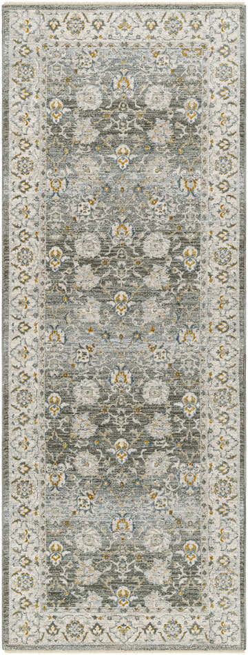 Close-up of the Amaru Green Textured Rug with Fringes. Features olive, gray, and mustard floral pattern. Design-Runner-2710