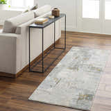 Living room scene with Elina Textured Abstract Rug in dusty sage, blue, and gray. Modern sofa and console table. Roomscene-Runner