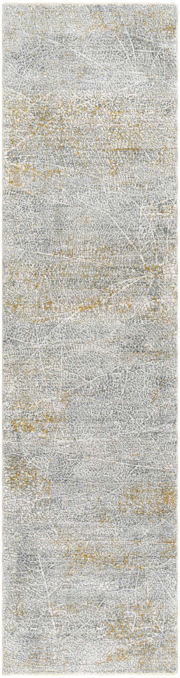 Close-up of the Mila Textured Rug with Fringes. Features cloud gray, dark beige, and gray tones with a subtle textured pattern. Design-Runner-2710
