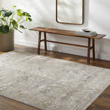 Entryway with wood floors and the beige Gioia Area Rug. Bench, mirror, and plant complete the farmhouse look. Roomscene-Rectangle