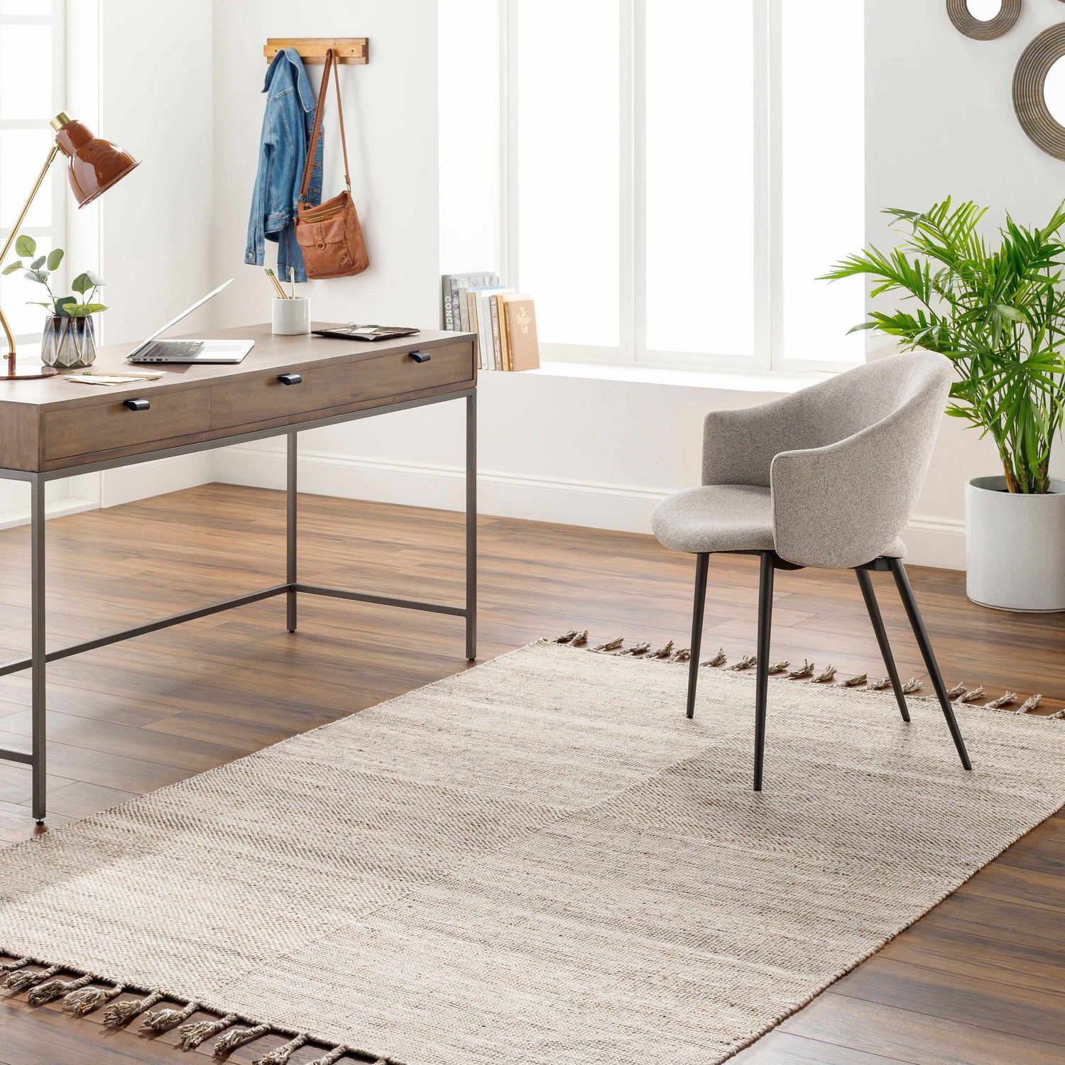 Bright home office with a beige Anaya Area Rug, wood desk, gray chair, and wood floors. Roomscene-Rectangle