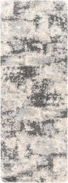 Close-up of the Selcuklu Area Rug. Black, cream, and light gray shag rug with a contemporary abstract pattern. Design-Runner-2773