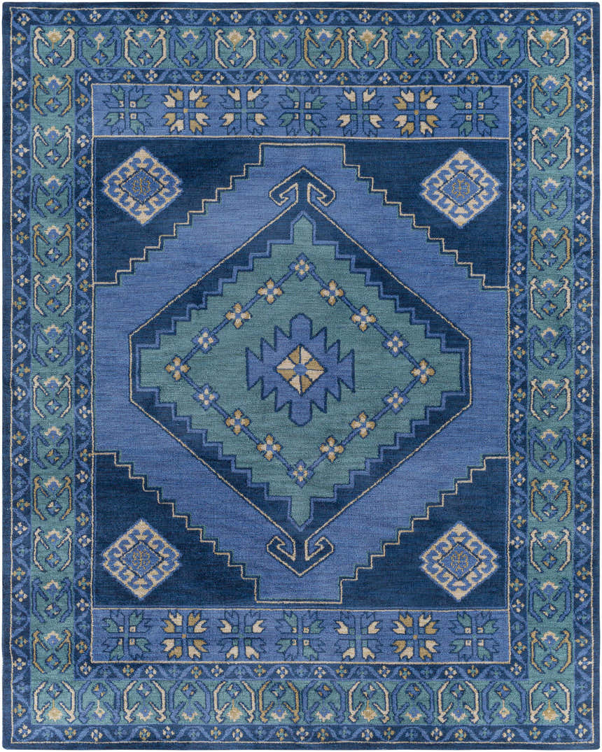 Close-up of the Selden Area Rug in shades of blue and teal with a geometric diamond pattern and floral border. Design-Rectangle-7696