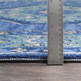 Close up of Selden Area Rug showing texture, pile height, and detailed blue, teal, and cream pattern. Pile