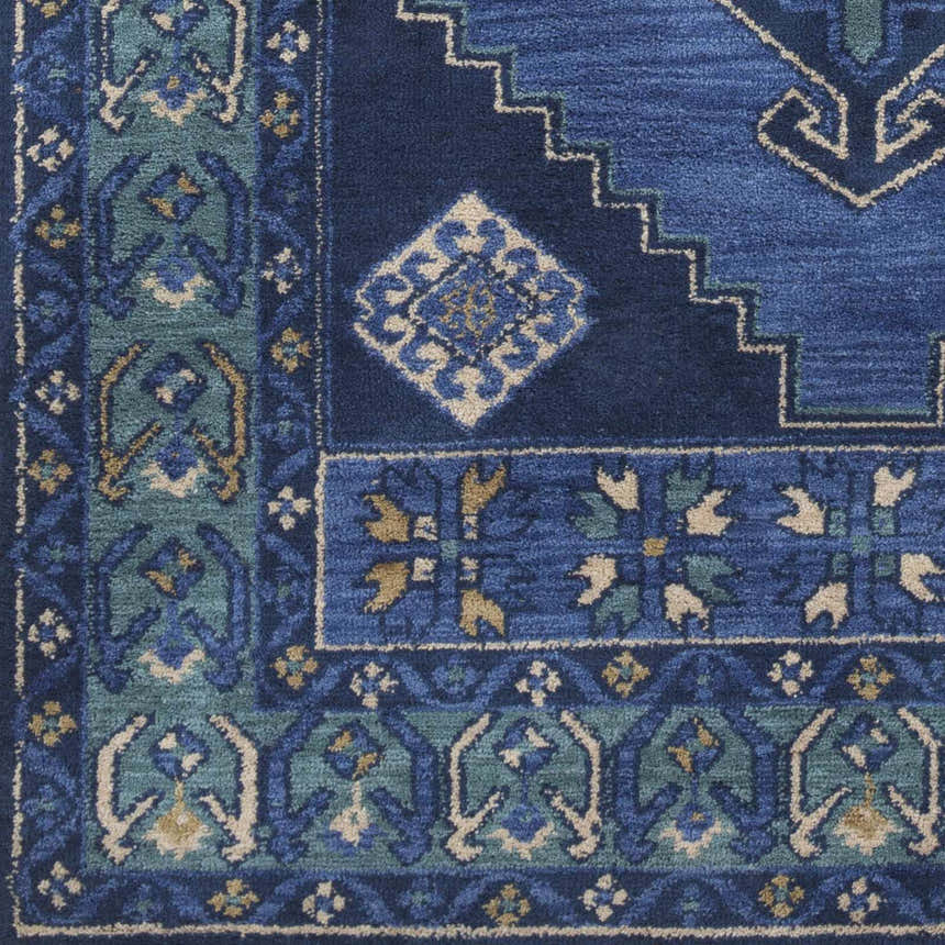 Close-up of the Selden Area Rug in shades of blue and teal with a geometric, floral-inspired pattern. Swatch