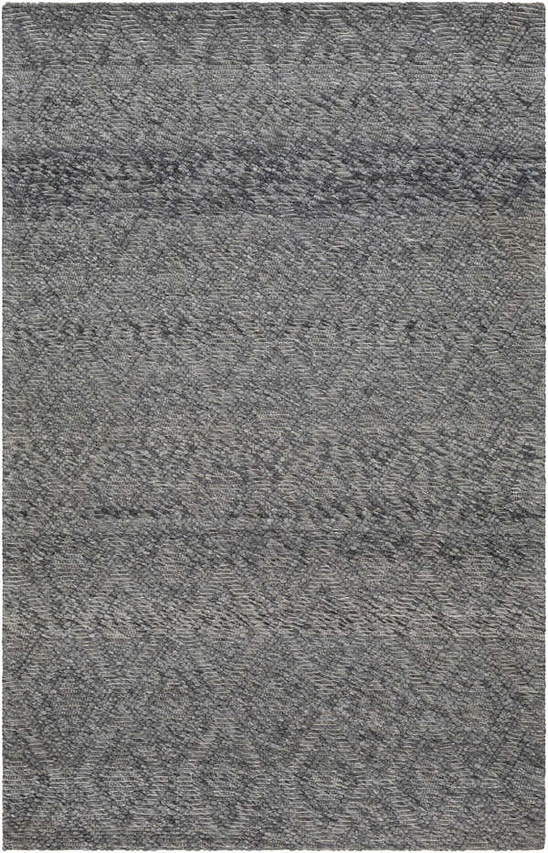Close-up of the Kasib Dark Gray rug, showcasing its hand woven texture and subtle geometric pattern in shades of gray and smoke. Design-Rectangle-576