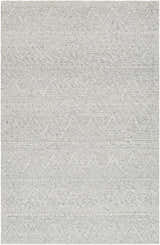 Close-up of the hand-woven Kyung Gray Area Rug showing its light gray color, geometric pattern, and textured wool blend. Design-Rectangle-576