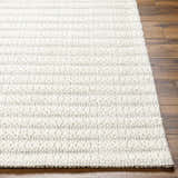 Close up of the Laleh Cream Area Rug showing the textured, hand woven design and beige color. Front