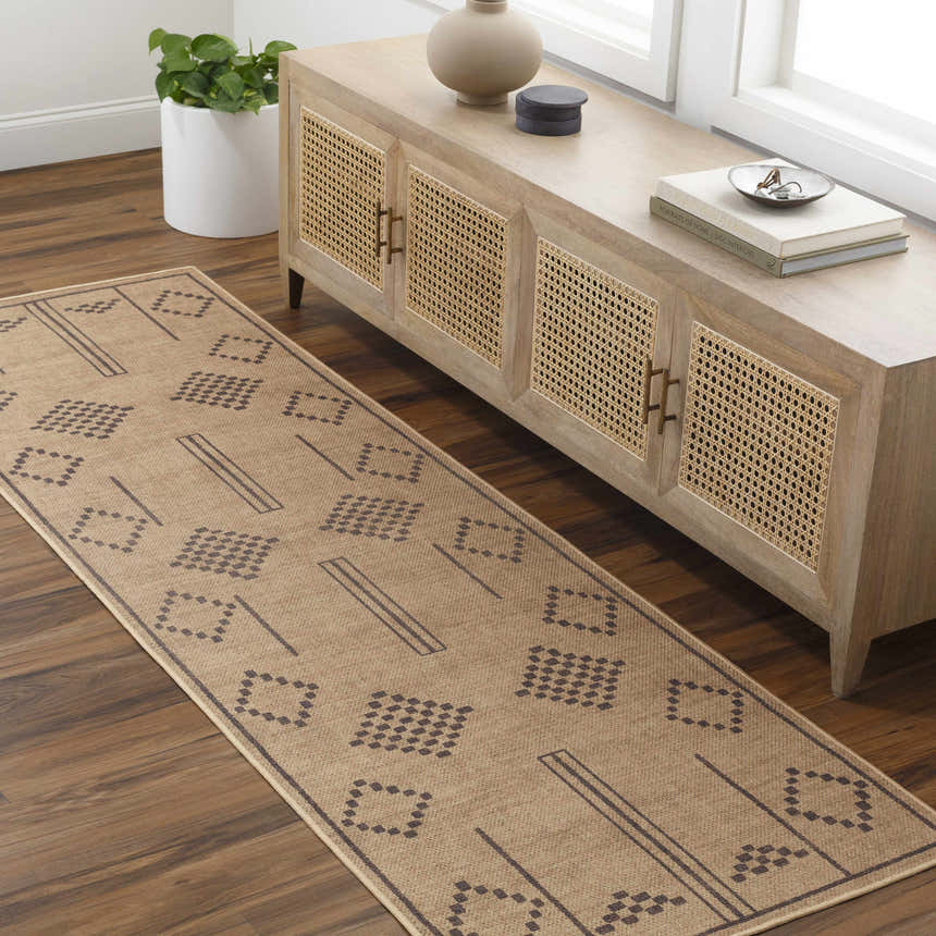 Entryway with camel Fathi Washable Area Rug runner, wood floors, and a natural wood console table. Roomscene-Runner
