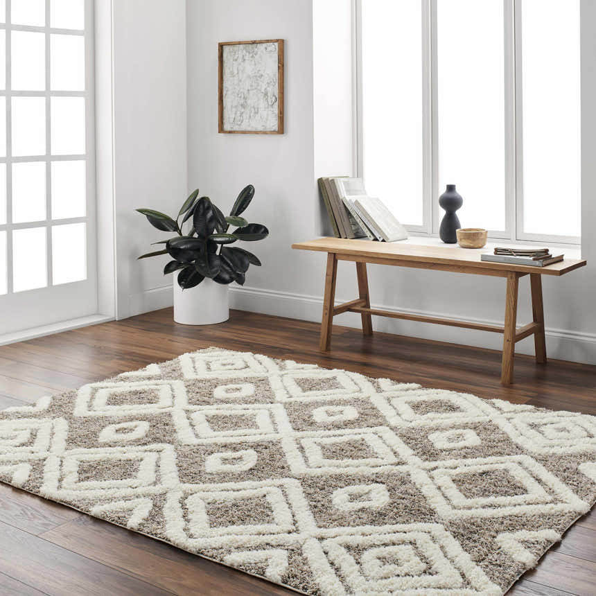 Farmhouse-style room with a bone and cloud gray Nima Area Rug, wood floors, and bench. Roomscene-Rectangle
