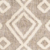 Close-up of the Nima Area Rug, a shag rug with a geometric diamond pattern in bone and multi brown. Swatch