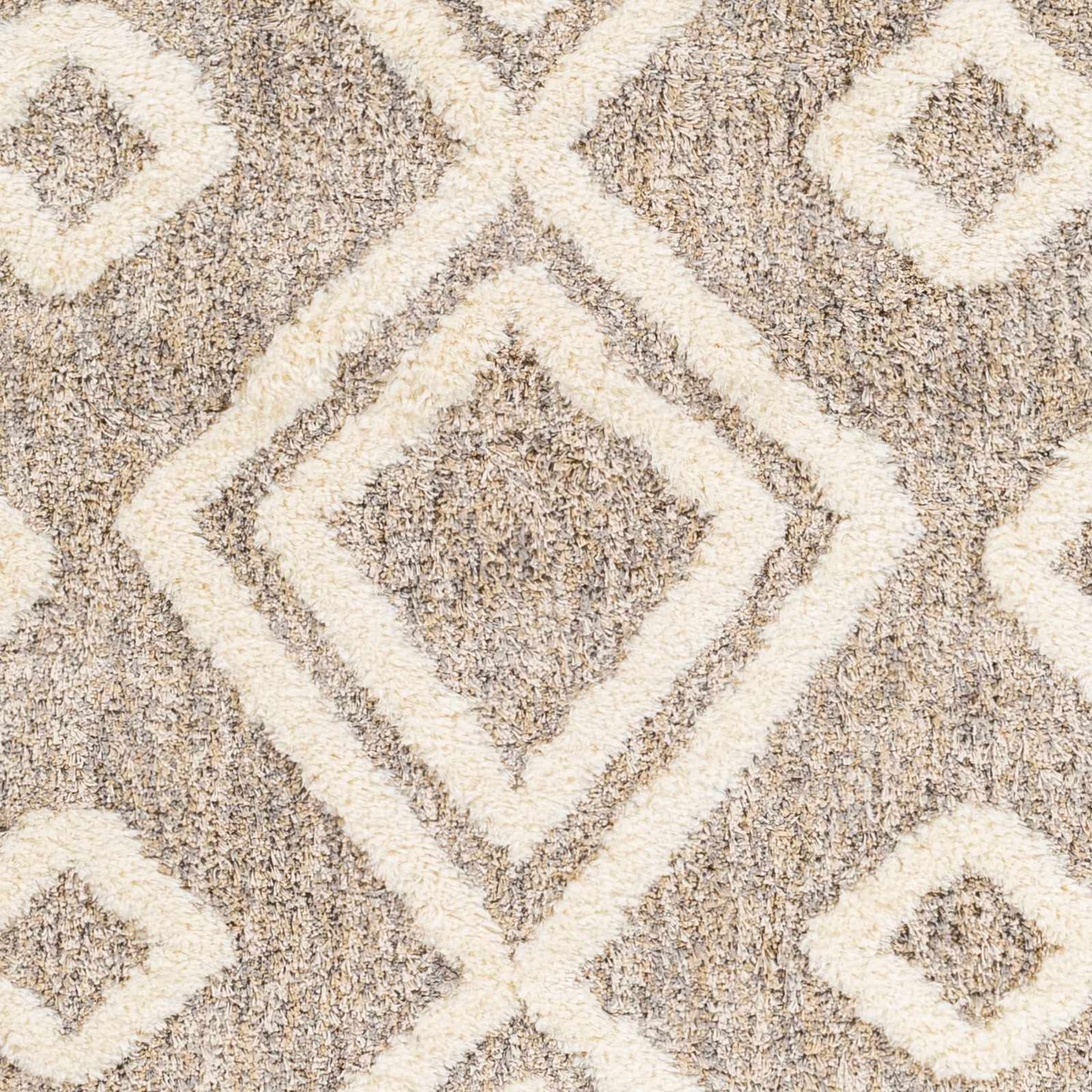 Close-up of the Nima Area Rug, a shag rug with a geometric diamond pattern in bone and multi brown. Swatch