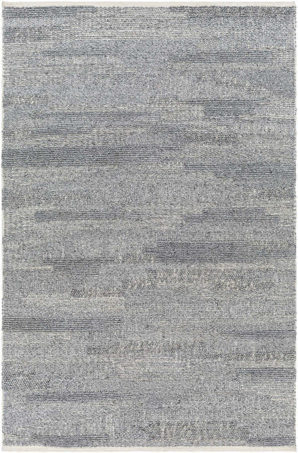 Close-up of the hand woven Chepe Area Rug. Features charcoal, gray, and silver tones in a contemporary horizontal pattern. Design-Rectangle-576
