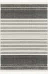 Close-up of the Bubba Area Rug. Farmhouse style rug with charcoal, gray, and white geometric stripes and tassels. Design-Rectangle-537