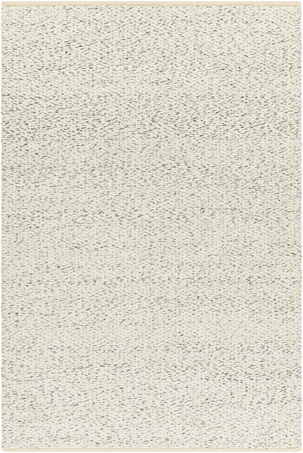 Close-up of the hand-loomed Gilad Area Rug. Beige rug with a subtle dark brown pattern and a flat weave texture. Design-Rectangle-576