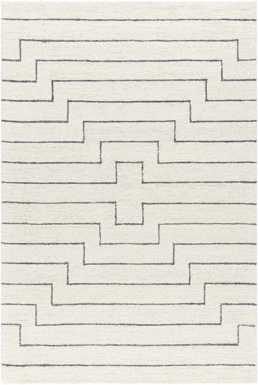 Close-up of the hand-tufted Wyome Area Rug. Off-white wool rug with a gray geometric pattern. Farmhouse style. Design-Rectangle-576