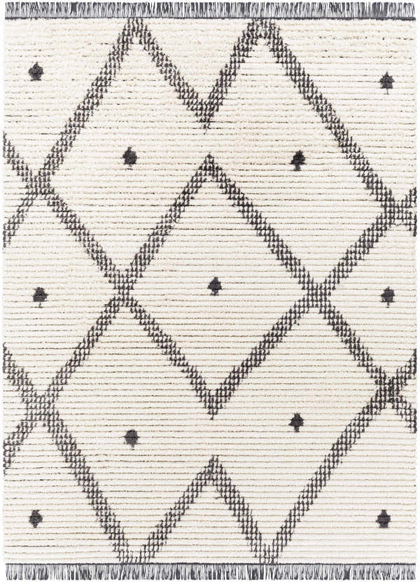 Close-up of the Shae Area Rug, a cream rug with a black geometric diamond pattern and fringe. Design-Rectangle-537
