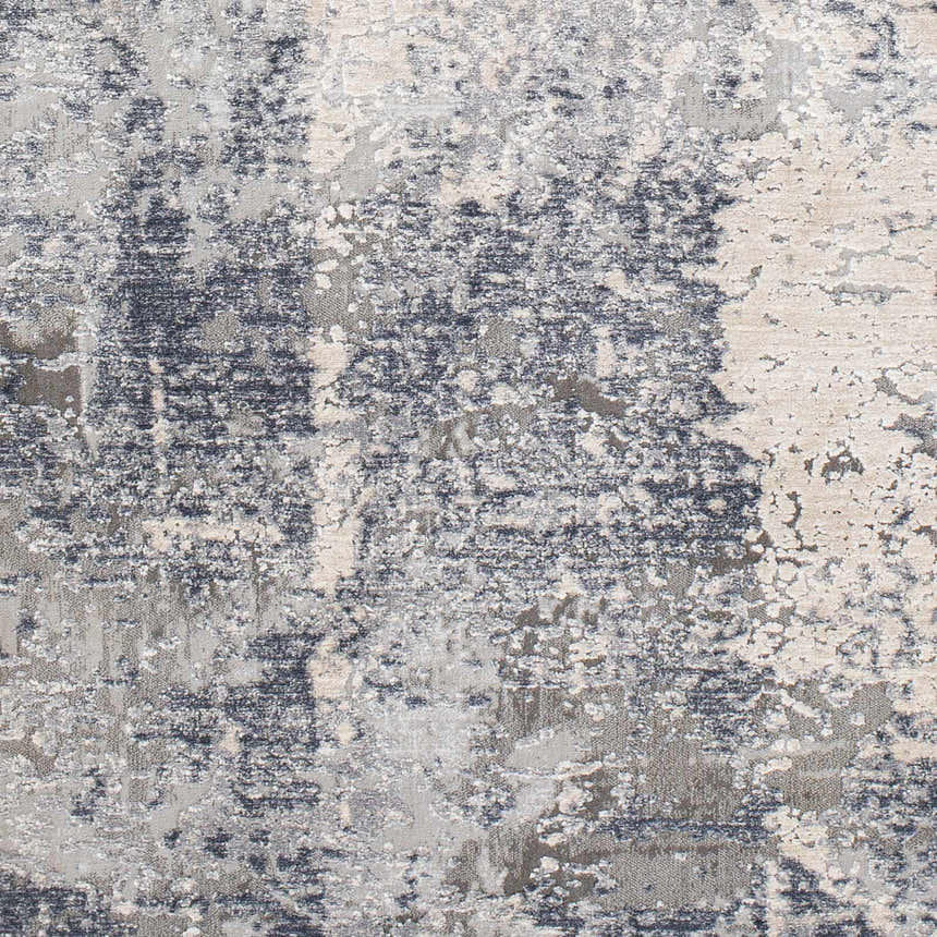Close-up of the Shartlesville Textured Luxe Rug. Abstract design in charcoal, gray, light gray, and taupe hues. Swatch