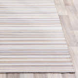 Close-up of the hand woven Shawville Area Rug. Brown, gray, off white, and tan stripes on a farmhouse style olefin rug. Front