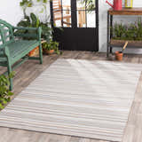 Sunroom scene with a striped Shawville Area Rug, green bench, plants, and potting table. Roomscene-Rectangle