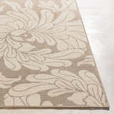 Close-up of the beige Sherard Area Rug featuring a large floral pattern. Contemporary style rug. Front