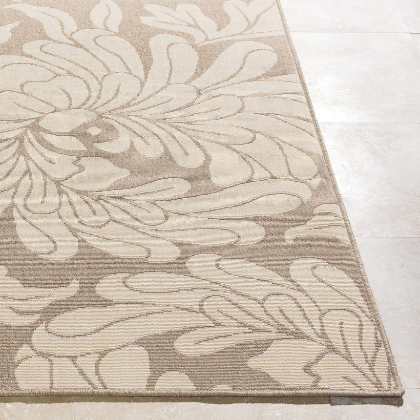 Close-up of the beige Sherard Area Rug featuring a large floral pattern. Contemporary style rug. Front