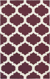 Close-up of the Shotton Area Carpet, a hand-woven wool rug with a dark purple and ivory geometric pattern. Design-Rectangle-58