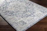 Close-up of the Shotts Thick Luxe Rug. Cream and denim blue oriental pattern on a soft, textured rug. Corner