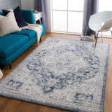 Living room scene with a blue sofa and Shotts Thick Luxe Rug in denim and cream. Roomscene-Rectangle