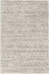 Close-up of the Shortland Premium Area Rug. Hand-loomed cotton and viscose rug with a gray geometric pattern on an ivory background. Design-Rectangle-46