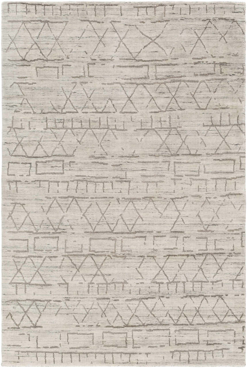 Close-up of the Shortland Premium Area Rug. Hand-loomed cotton and viscose rug with a gray geometric pattern on an ivory background. Design-Rectangle-46