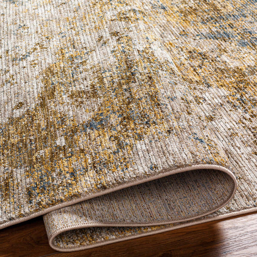 Close-up of the Aleka Rich Textured Rug in bone, clay, and gray, showing its woven texture and backing detail. Fold