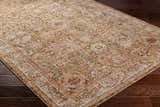 Close-up of the Ange Tan Rich Textured Traditional Rug, showcasing its bone, clay, and walnut colors and farmhouse style. Corner