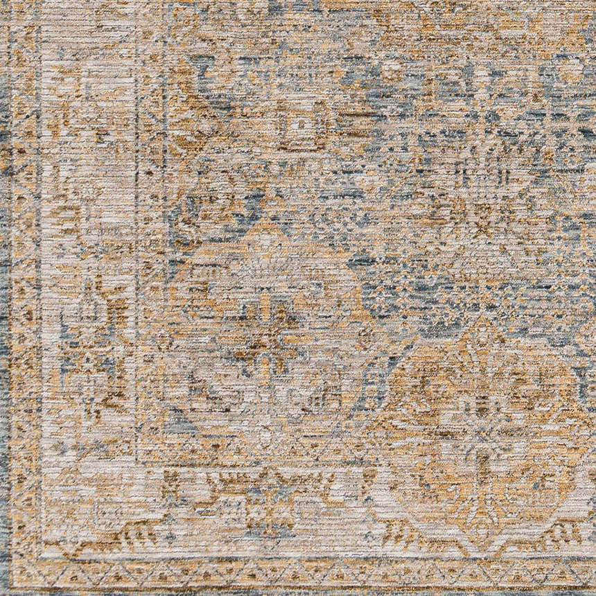 Close-up of the Ange Cream & Blue Rich Textured Rug, showcasing its traditional pattern and textured weave. Swatch
