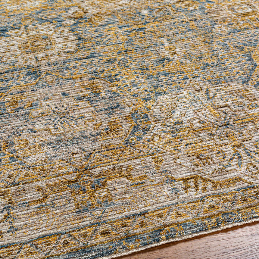 Close-up of the Ange Cream & Blue Rich Textured Rug showing its bone, blue, and gold colors and textured traditional design. Texture