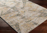 Close up of the Cadao Rich Textured Traditional Rug showing its light peach, mocha, and blue pattern. Corner